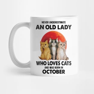 Never Underestimate An Old Lady Who Loves Cats And Was Born In October Mug